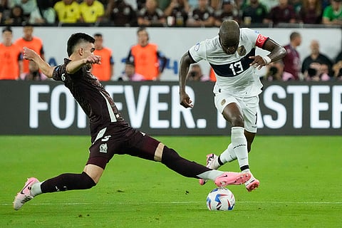 Johan Vasquez challenges Enner Valencia